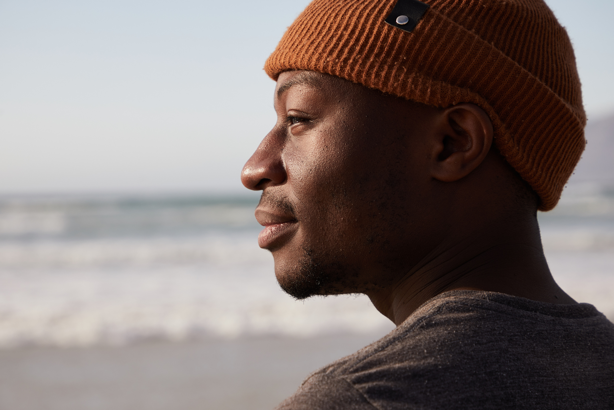 Happy black man near sea