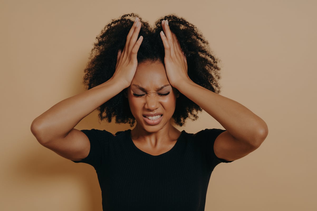 Shocked panic African American girl dressed in black T-shirt